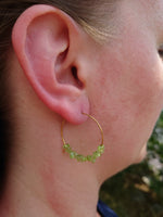 Hoop earrings with green peridot and gold stainless steel