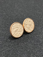 Cream colored salmon leather and rose gold stainless steel stud earrings